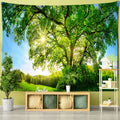 Wall tapestry showing a sunlit ancient tree in a green meadow
